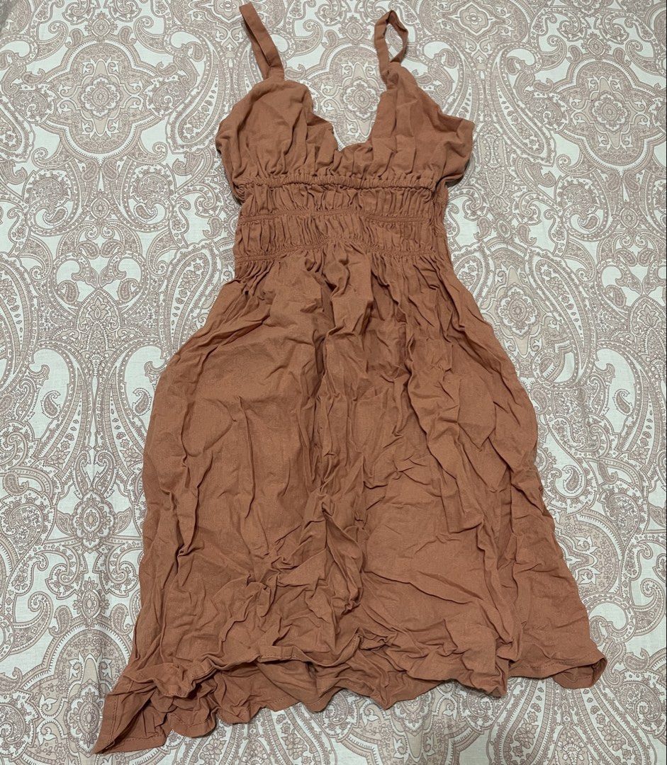 Smocked Bodice Spaghetti Strap Dress (Category: Dresses) located in Belison. Submitted by prelovedbyellery (Listing ID 1439962251, Image 1). Description: - Cute mini dress - Smocked bodice with V-neckline - Adjustable spaghetti straps - Flowy A-line skirt - Crinkled fabric texture - Perfect for casual outings or beach vacations.
