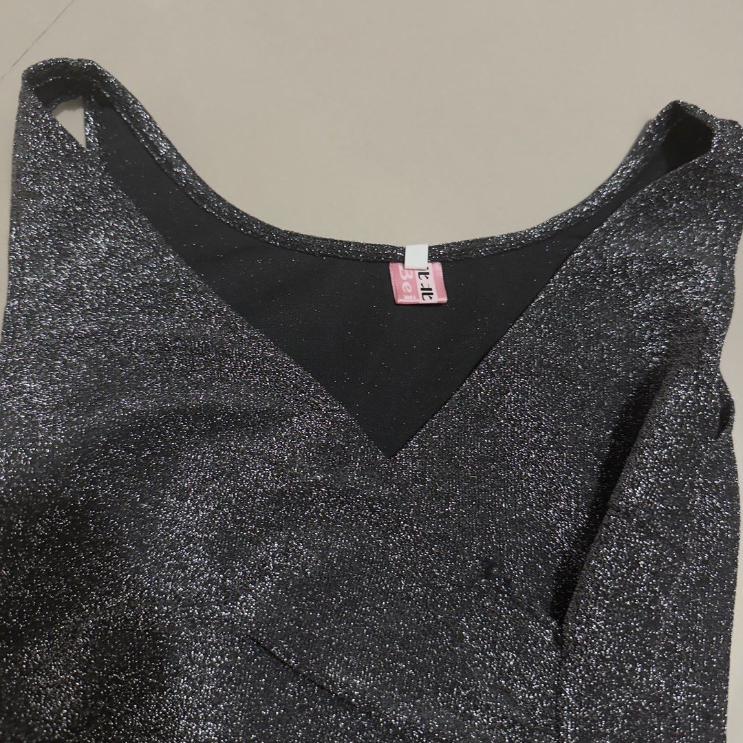 Sparkly Party Dress (Category: Dresses) located in Quezon City. Submitted by pljdlrs (Listing ID 1439913844, Image 3). Description: - Shimmering silver fabric - Flattering V-neckline - Elegant side ruching - Chic side slit for added flair - Sleeveless design - Perfect for parties and nights out.