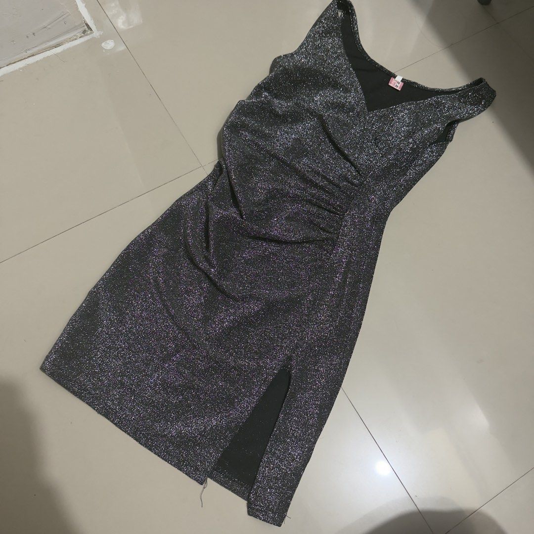 Sparkly Party Dress (Category: Dresses) located in Quezon City. Submitted by pljdlrs (Listing ID 1439913844, Image 1). Description: - Shimmering silver fabric - Flattering V-neckline - Elegant side ruching - Chic side slit for added flair - Sleeveless design - Perfect for parties and nights out.