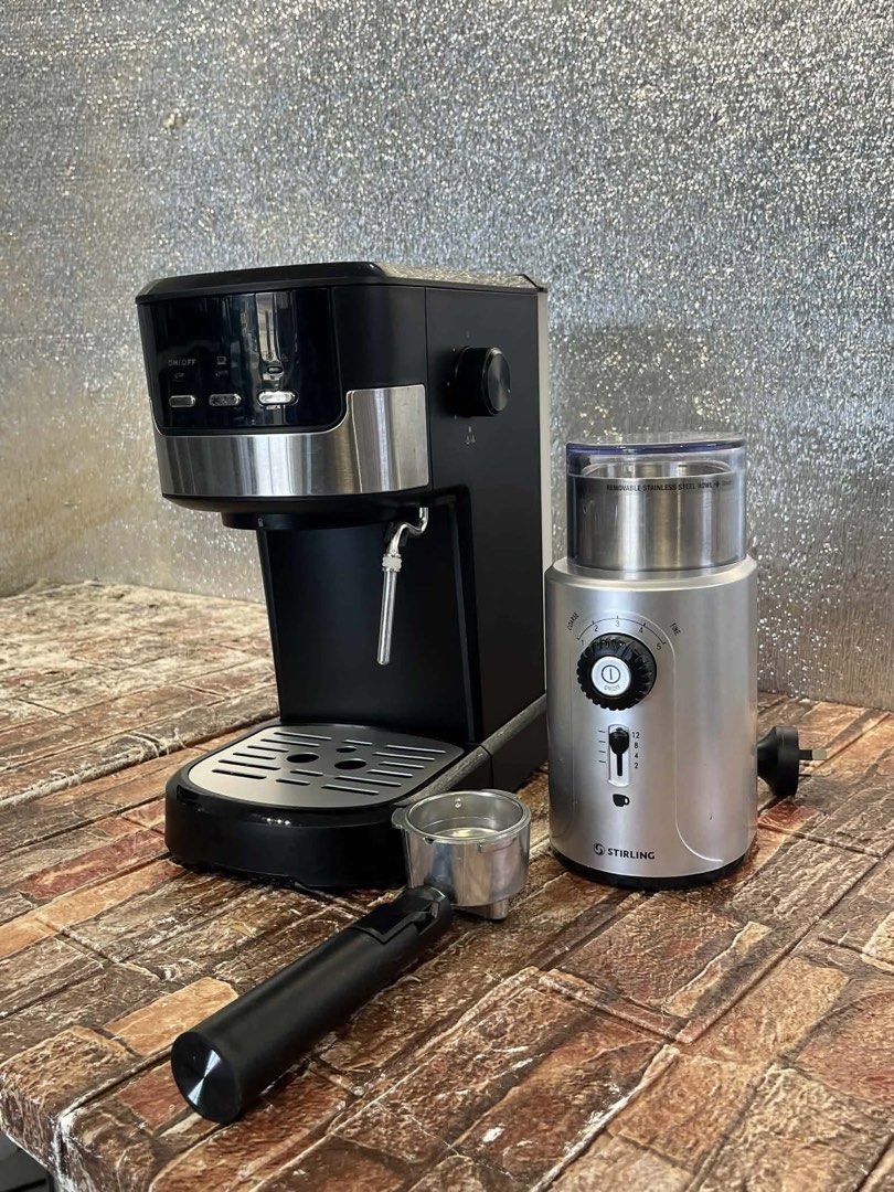 Stirling Coffee Grinder and Anko Espresso Machine Set (Category: Coffee Machines & Makers) located in Pulilan. Submitted by sebbii (Listing ID 1439951309, Image 1). Description: - Stirling espresso machine and coffee grinder set - Sleek black and silver design - Easy-to-use controls - Includes portafilter for espresso shots - Silver coffee grinder for fresh grounds - Elevate your home coffee brewing experience.