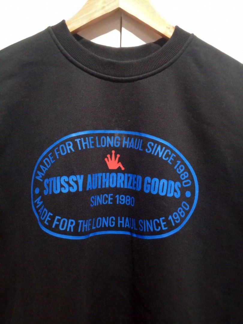 Stussy Authorized Goods Black Sweatshirt (Category: Coats, Jackets and Outerwear) located in Guagua. Submitted by mrkrygn (Listing ID 1439947126, Image 2). Description: - Classic black Stussy sweatshirt - Features iconic 'Authorized Goods' oval logo (blue and red) - Text around logo: 'Made for the long haul since 1980' - Comfortable and stylish streetwear piece Issue: Cut tags and wash tags..
