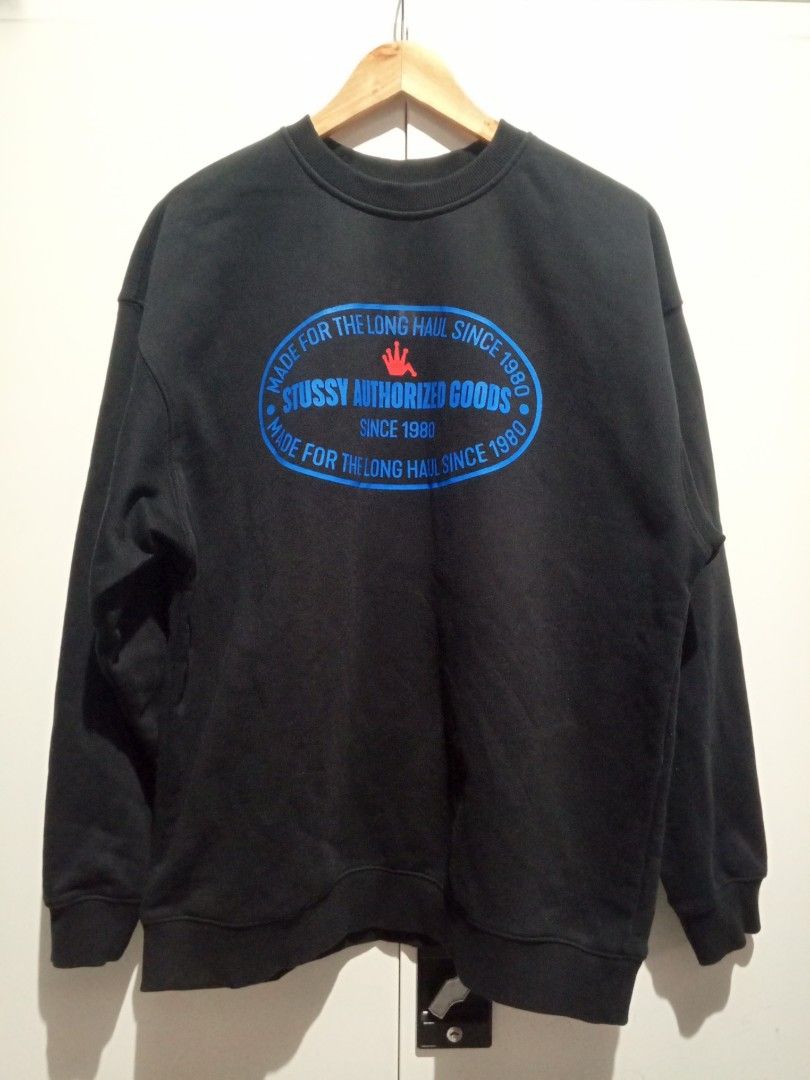 Stussy Authorized Goods Black Sweatshirt (Category: Coats, Jackets and Outerwear) located in Guagua. Submitted by mrkrygn (Listing ID 1439947126, Image 1). Description: - Classic black Stussy sweatshirt - Features iconic 'Authorized Goods' oval logo (blue and red) - Text around logo: 'Made for the long haul since 1980' - Comfortable and stylish streetwear piece Issue: Cut tags and wash tags..