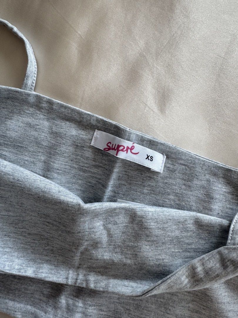 Supre Gray Cropped Tank Top XS (Category: Sleeveless) located in Manila. Submitted by camille_cai (Listing ID 1439873285, Image 3). Description: - Supre gray tank top - Size: XS - Features a square neckline and thin straps - Double lined - Brand new .