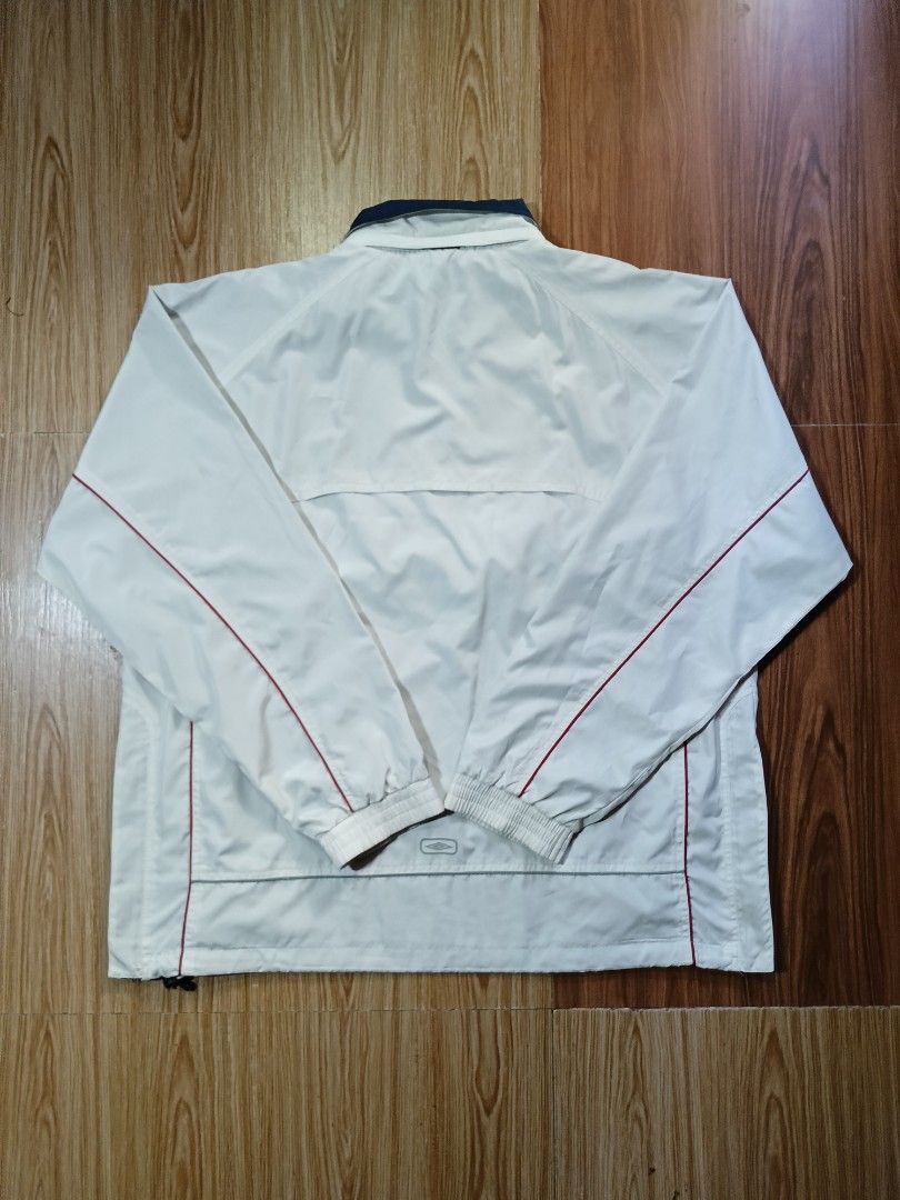 Umbro nylon material (Category: Hoodies) located in Manila. Submitted by alwaysgoodzthrift (Listing ID 1439909979, Image 2). Description: - Brand: Umbro - Material: Nylon - Color: Cream with red piping and navy collar - Style: Pullover jacket - Size: L - Condition: Great - Features: Lightweight, comfortable, sporty design.