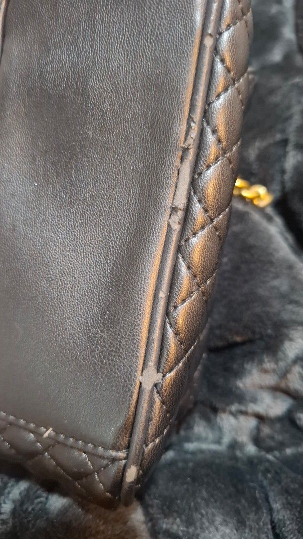 Versace Jeans Couture Quilted Shoulder Bag (Category: Luxury Bags & Wallets) located in Pasay City. Submitted by kgemsluxuryboutique (Listing ID 1439863846, Image 3). Description: - Versace Jeans Couture shoulder bag - Black quilted design - Gold chain strap - Studded detailing - Magnetic closure - Branded interior - Exterior condition: Shows wear on edges and clasp - Interior condition: Clean ORIGINAL po not fake. With etiketa. **Now on sale 100