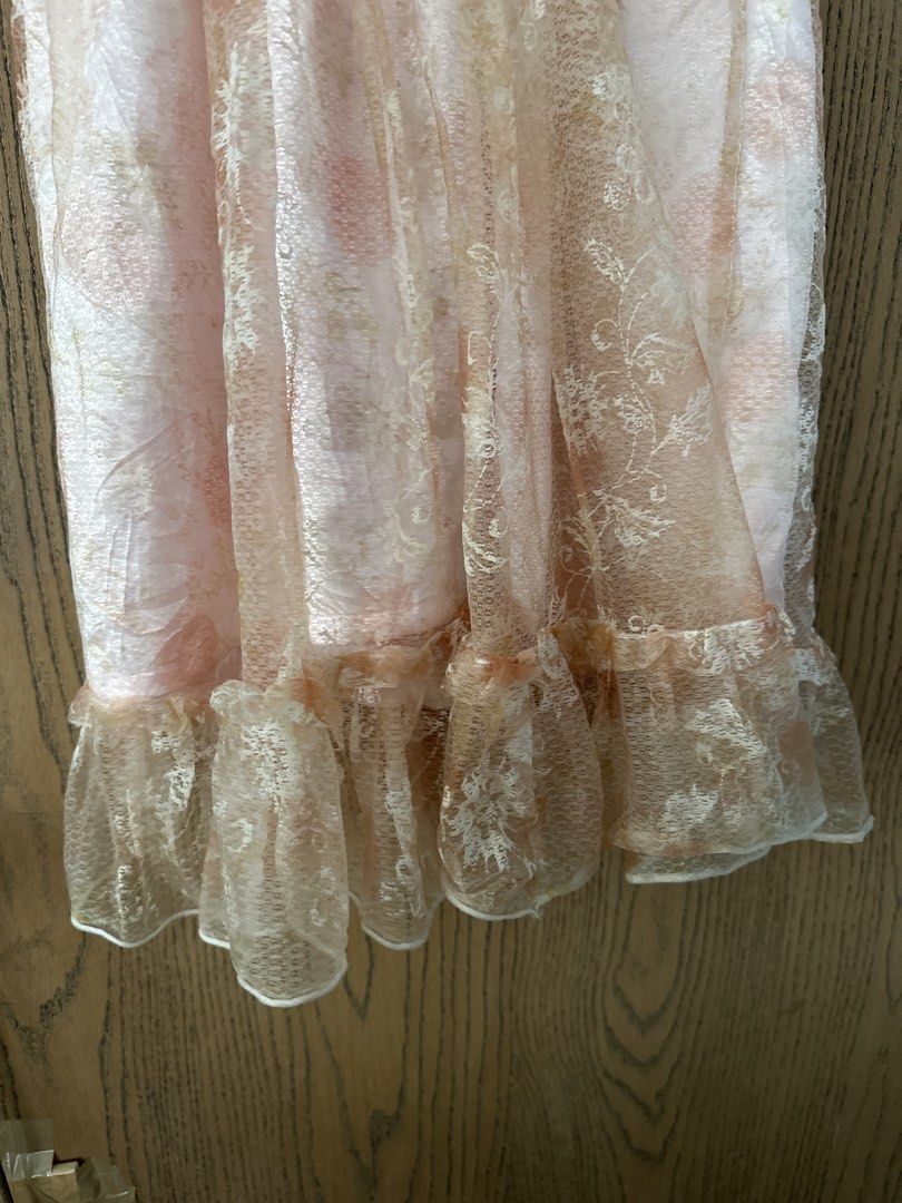 Vintage Lace Dress (Category: Dresses) located in Quezon City. Submitted by glcsx (Listing ID 1439880313, Image 3). Description: - Vintage peach pink lace dress - Features a V-neckline - Fitted bodice - Ruffled hemline - Soft peach color with subtle pattern - Ideal for special events Length 37in Waist 13.5in.