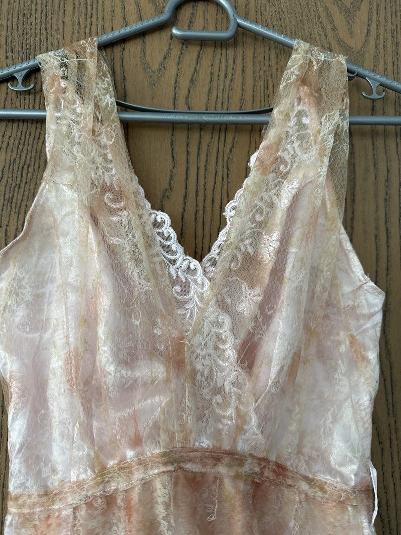 Vintage Lace Dress (Category: Dresses) located in Quezon City. Submitted by glcsx (Listing ID 1439880313, Image 2). Description: - Vintage peach pink lace dress - Features a V-neckline - Fitted bodice - Ruffled hemline - Soft peach color with subtle pattern - Ideal for special events Length 37in Waist 13.5in.