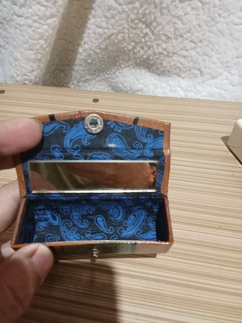 Vintage Lipstick Holder with Mirror (Category: Makeup) located in Bocaue. Submitted by marajapansurplus (Listing ID 1439915697, Image 2). Description: - Selling as it is - Beautiful embossed floral design - Secure snap closure - Built-in mirror inside - Stylish paisley fabric lining.