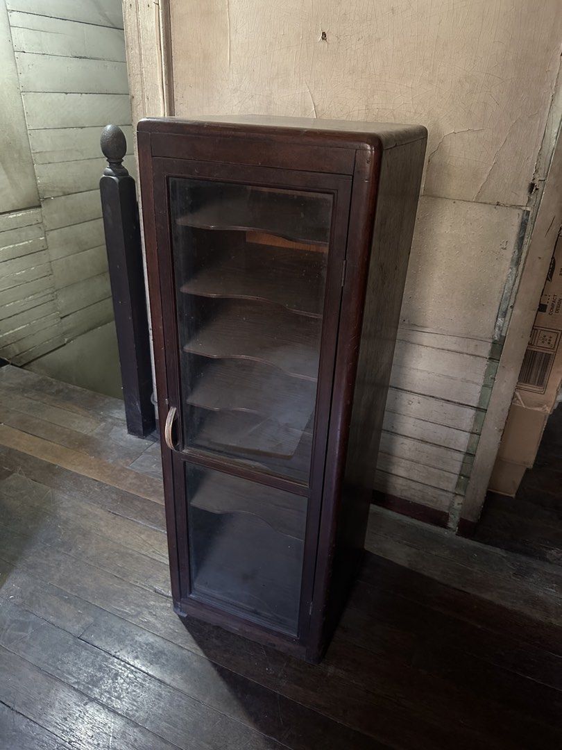 Vintage Wooden Display Cabinet with Glass Door (Category: Shelves, Cabinets & Racks) located in Manila. Submitted by clamchowder19 (Listing ID 1439942855, Image 2). Description: - Vintage wooden display cabinet - Features a glass door - Multiple shelves for display or storage - Classic dark wood finish - Compact design, suitable for any room - Ideal for showcasing collectibles.