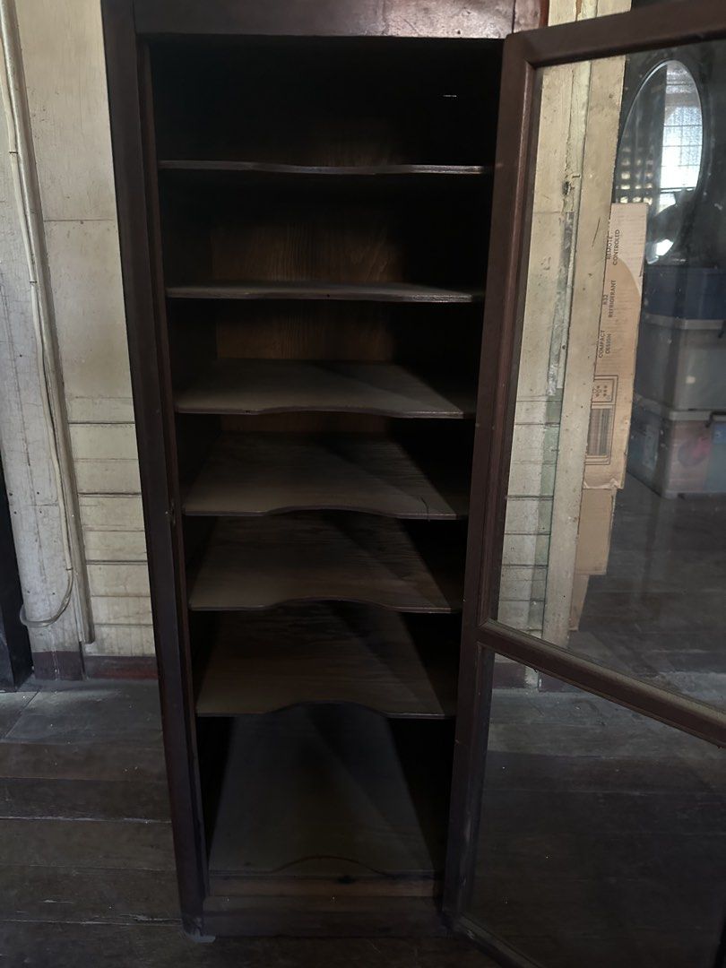 Vintage Wooden Display Cabinet with Glass Door (Category: Shelves, Cabinets & Racks) located in Manila. Submitted by clamchowder19 (Listing ID 1439942855, Image 3). Description: - Vintage wooden display cabinet - Features a glass door - Multiple shelves for display or storage - Classic dark wood finish - Compact design, suitable for any room - Ideal for showcasing collectibles.