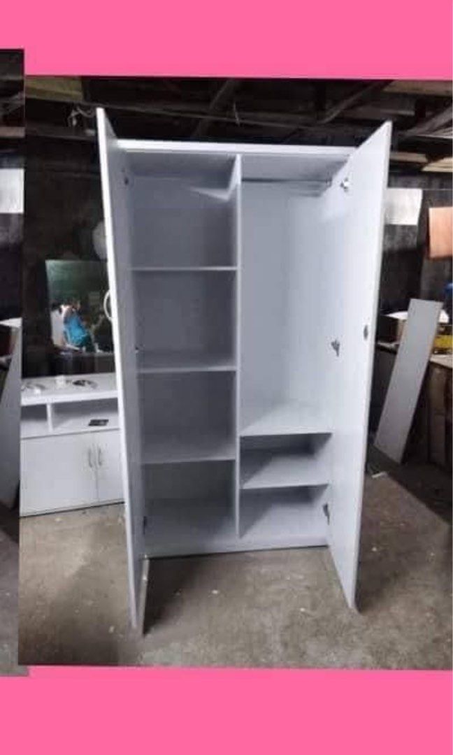 White 2-Door Wardrobe with Mirror and Drawers (Category: Shelves, Cabinets & Racks) located in Manila. Submitted by julianairene (Listing ID 1439908836, Image 2). Description: - White wardrobe with a full-length mirror on one door. - Two doors open to reveal spacious storage. - Includes shelves and a hanging rod inside. - Three drawers at the bottom for extra organization. - Ideal for storing clothes, shoes, and accessories. Has slight issues as 
