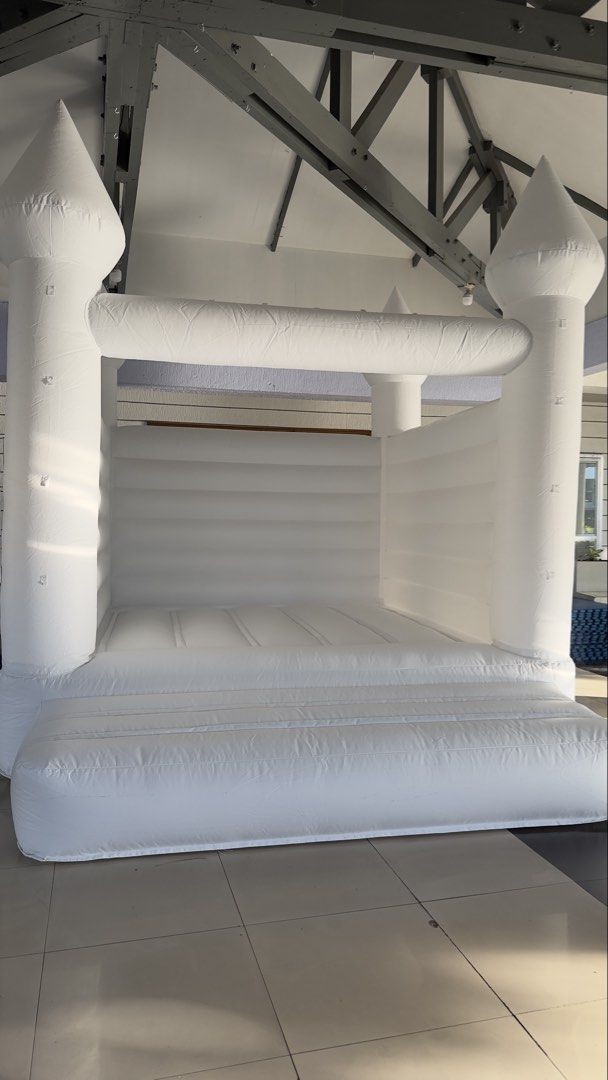White Inflatable Castle Bouncer (Category: Infant Playtime) located in Bulacan. Submitted by meekeniee (Listing ID 1439807704, Image 1). Description: White inflatable castle bouncer Perfect for parties and events rental Inclusions - Airblower - 16 pcs Fence - Floormats .