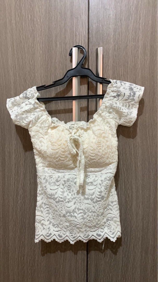White Lace Off-Shoulder dainty Tie-Front Top (Category: Blouses) located in Manila. Submitted by mareeya__ (Listing ID 1439909208, Image 1). Description: - Chic white lace top - Off-shoulder design - Short sleeves - Flattering tie-front detail at the bust - Scalloped hemline - Perfect for a stylish and feminine look - Versatile for various occasions.
