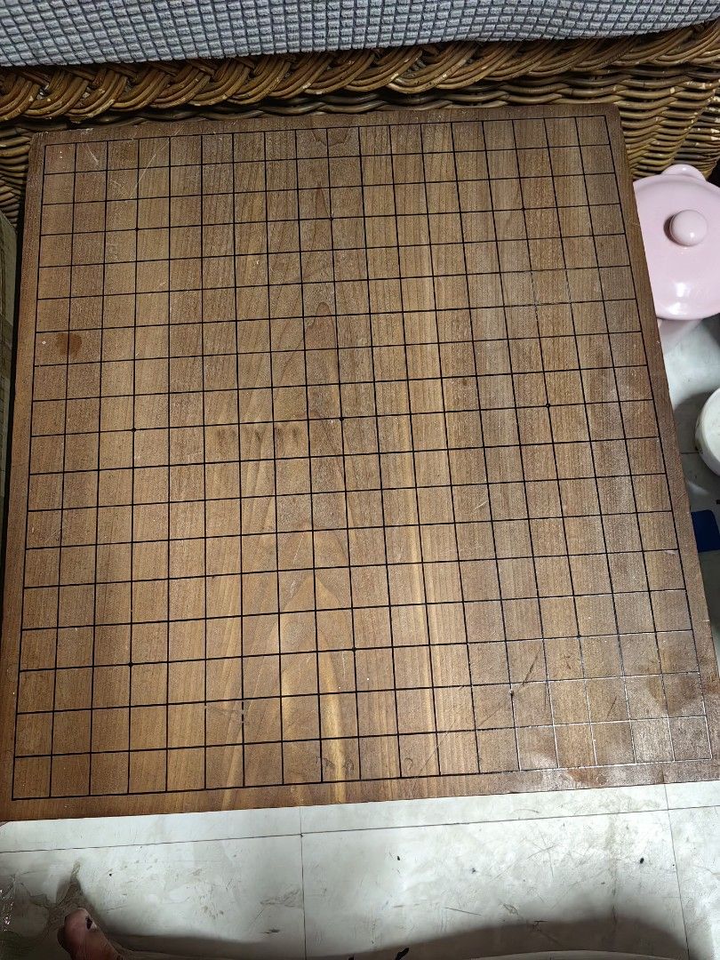 Wooden Go Board (Category: Board Games & Puzzles) located in Rizal. Submitted by gkstcenit (Listing ID 1439855917, Image 1). Description: - Wooden Go board - Square shape - Solid wood construction - Decorative legs - Dimensions: Approximately 16" x 16" x 10" - Classic board game.