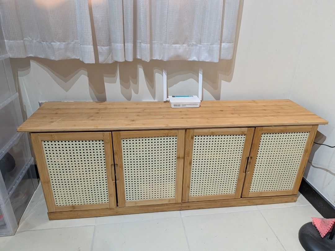 Wooden Shoe Cabinet with Rattan Doors (Category: Shelves, Cabinets & Racks) located in Dasmarinas. Submitted by miggy15 (Listing ID 1439984132, Image 1). Description: - Stylish and functional wooden shoe cabinet - Four doors for easy access - Natural wood finish with woven rattan door panels - Modern and airy aesthetic - Perfect for organizing footwear and tidying entryways - Ample storage space with multiple shelves.