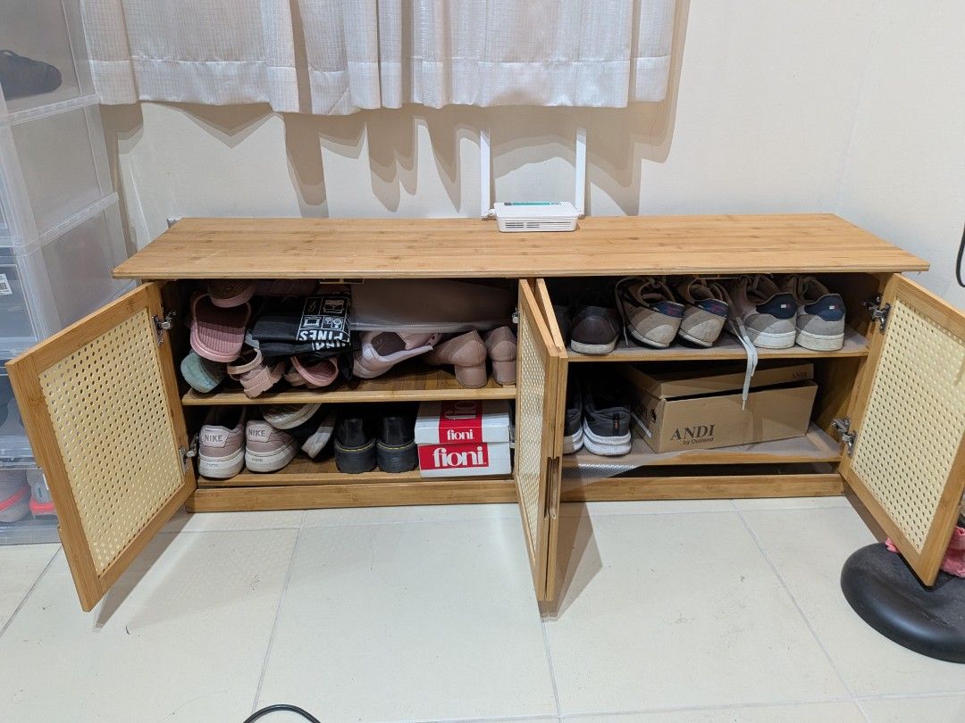 Wooden Shoe Cabinet with Rattan Doors (Category: Shelves, Cabinets & Racks) located in Dasmarinas. Submitted by miggy15 (Listing ID 1439984132, Image 2). Description: - Stylish and functional wooden shoe cabinet - Four doors for easy access - Natural wood finish with woven rattan door panels - Modern and airy aesthetic - Perfect for organizing footwear and tidying entryways - Ample storage space with multiple shelves.
