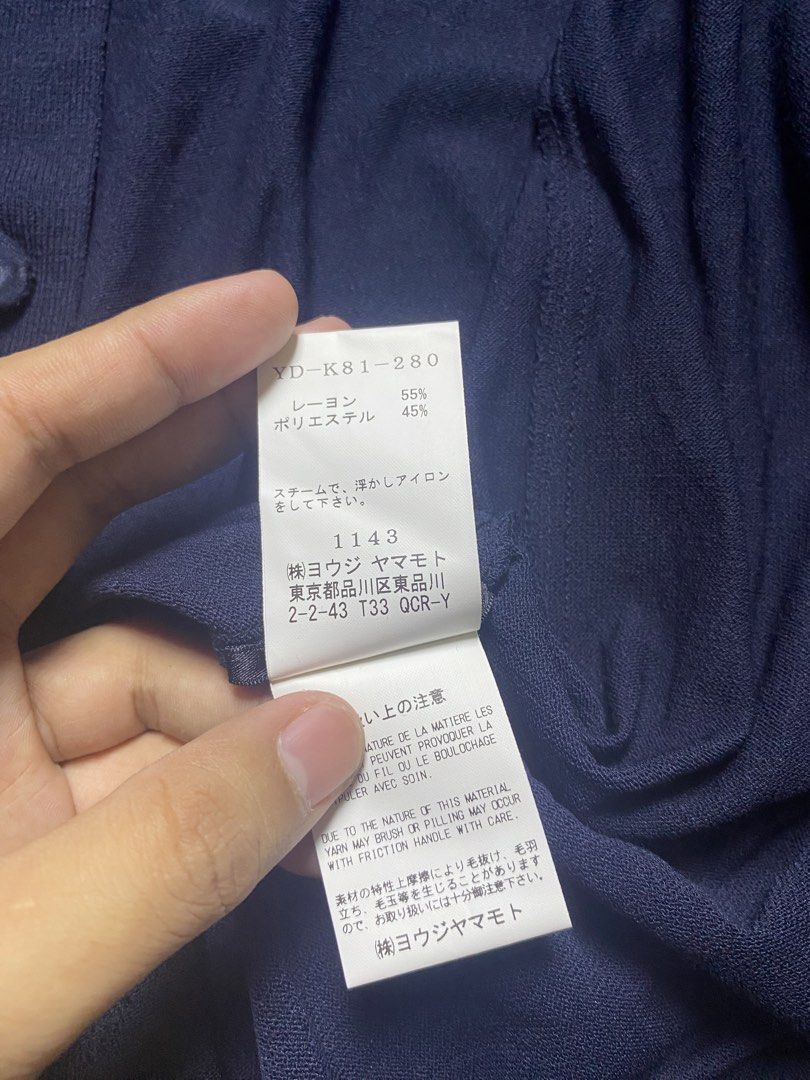 Y's by Yohji Yamamoto Navy poloshirt (Category: Luxury Apparel) located in Olongapo. Submitted by copnsold (Listing ID 1439883308, Image 3). Description: - Y's by Yohji Yamamoto navy knit shirt - Size 2 - Made in Japan - Features a collared neckline and short sleeves - Buttoned closure - Fabric: 55% rayon, 45% polyester - Care instructions: Do not bleach, tumble dry, or iron 32”Length 29”Width .