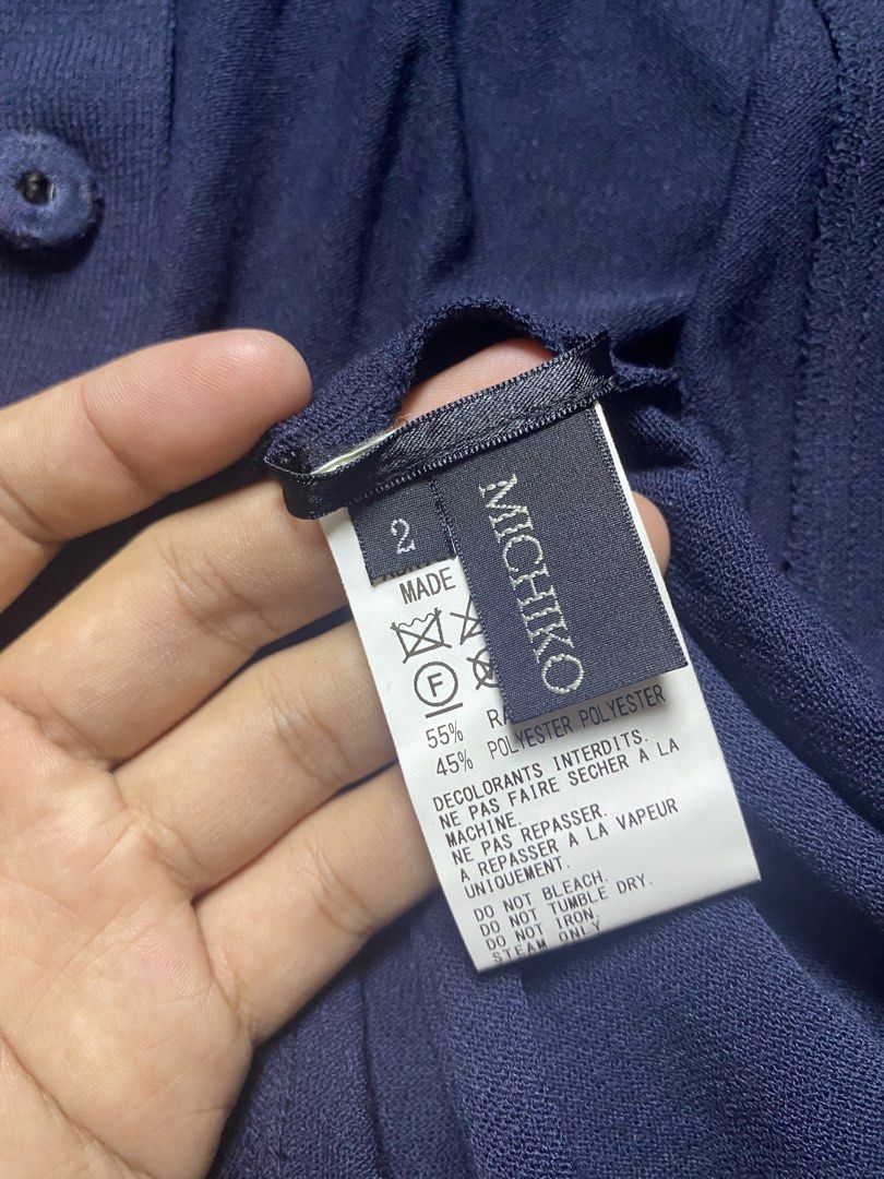 Y's by Yohji Yamamoto Navy poloshirt (Category: Luxury Apparel) located in Olongapo. Submitted by copnsold (Listing ID 1439883308, Image 2). Description: - Y's by Yohji Yamamoto navy knit shirt - Size 2 - Made in Japan - Features a collared neckline and short sleeves - Buttoned closure - Fabric: 55% rayon, 45% polyester - Care instructions: Do not bleach, tumble dry, or iron 32”Length 29”Width .