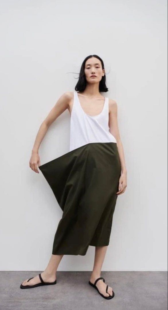 Zara combination/poplin Midi Dress (Category: Dresses) located in Cagayan de Oro. Submitted by jeirn (Listing ID 1439825125, Image 1). Description: Retails at 2,995 With tags Fits s to m - Zara midi dress - Asymmetrical design - White top, dark green skirt - Sleeveless - Scoop neckline - Lightweight fabric - Mid-calf length.