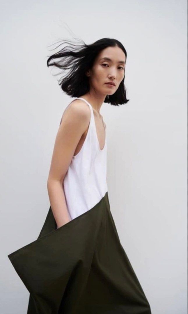 Zara combination/poplin Midi Dress (Category: Dresses) located in Cagayan de Oro. Submitted by jeirn (Listing ID 1439825125, Image 2). Description: Retails at 2,995 With tags Fits s to m - Zara midi dress - Asymmetrical design - White top, dark green skirt - Sleeveless - Scoop neckline - Lightweight fabric - Mid-calf length.