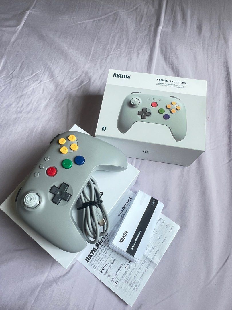 8BitDo 64 Bluetooth Controller (Gray) (Category: Controllers) located in Malabon City. Submitted by hellosmileyshop (Listing ID 1440006676, Image 2). Description: -Brand New w/ Box and Accessories (wire charger) RFS: Nagkamali ng bili, wala palang X Y buttons for pokopia sa switch. Payment & Delivery Method: E-wallet (Gcash, Paymaya, Mari) Bank Transfer (UB) Lalamove (Same day delivery) GogoXpress or LBC (of outside Greater NCR) Delivery fee shou