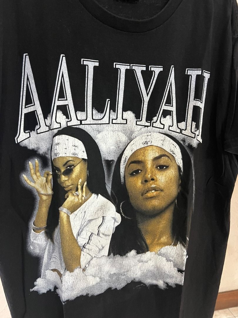 Aaliyah Graphic T-Shirt Black (Category: Tshirts & Polo Shirts ) located in Baguio. Submitted by pinkpixie (Listing ID 1440117320, Image 2). Description: - Black graphic t-shirt featuring a prominent Aaliyah print on the front. - Perfect for casual wear. - A must-have for fans of the iconic artist Aaliyah. - Adds a cool touch to any streetwear collection..