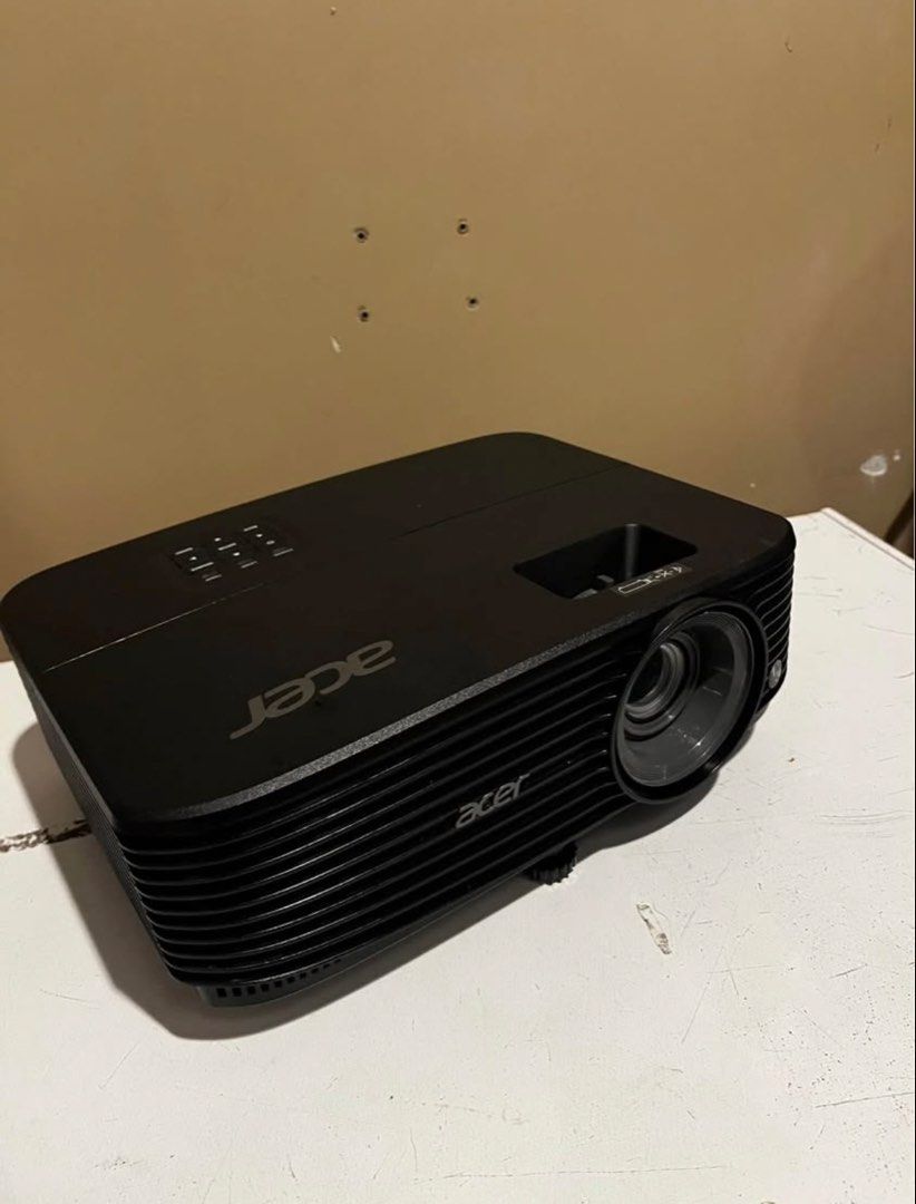 Acer Projector with Tripod Screen (Category: Projectors) located in Manila. Submitted by edmerpauli59010 (Listing ID 1440025419, Image 1). Description: - Complete home theater setup - Includes Acer projector (black, compact) - Comes with a large tripod screen - Perfect for movie nights, presentations, and gaming - Delivers immersive visuals.