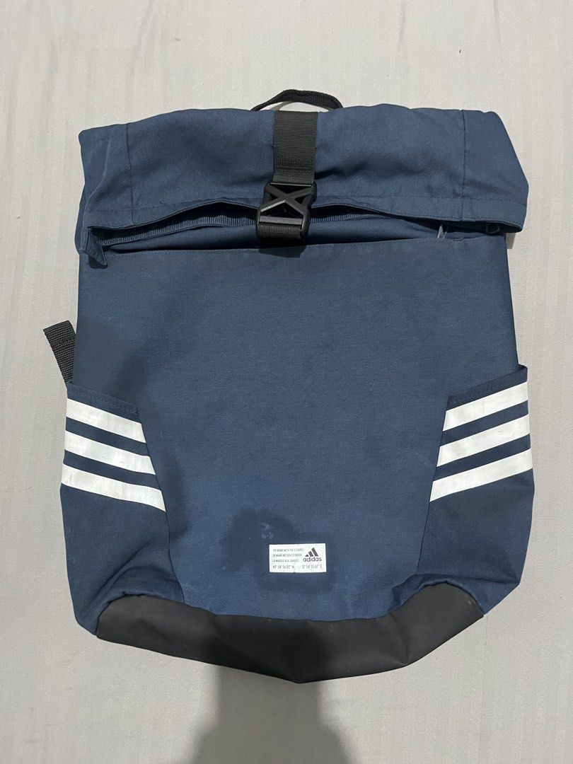 Adidas Rolltop Backpack Navy Blue (Category: Backpacks) located in Manila. Submitted by updilimangaragesale (Listing ID 1440145576, Image 2). Description: - Good condition - Has minimal stain n the front of the bag (can be washed). Other than that, no other issue :) .