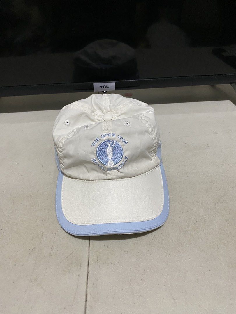 Adidas The Open Championship Golf Cap (Category: Caps & Hats) located in Manila. Submitted by resi.diaz (Listing ID 1440098425, Image 1). Description: - Adidas Golf Cap for The Open Championship - Features a light blue brim - Adjustable strap for a custom fit - Made from a comfortable polyester, polyamide, and elastane blend - One size fits all design.