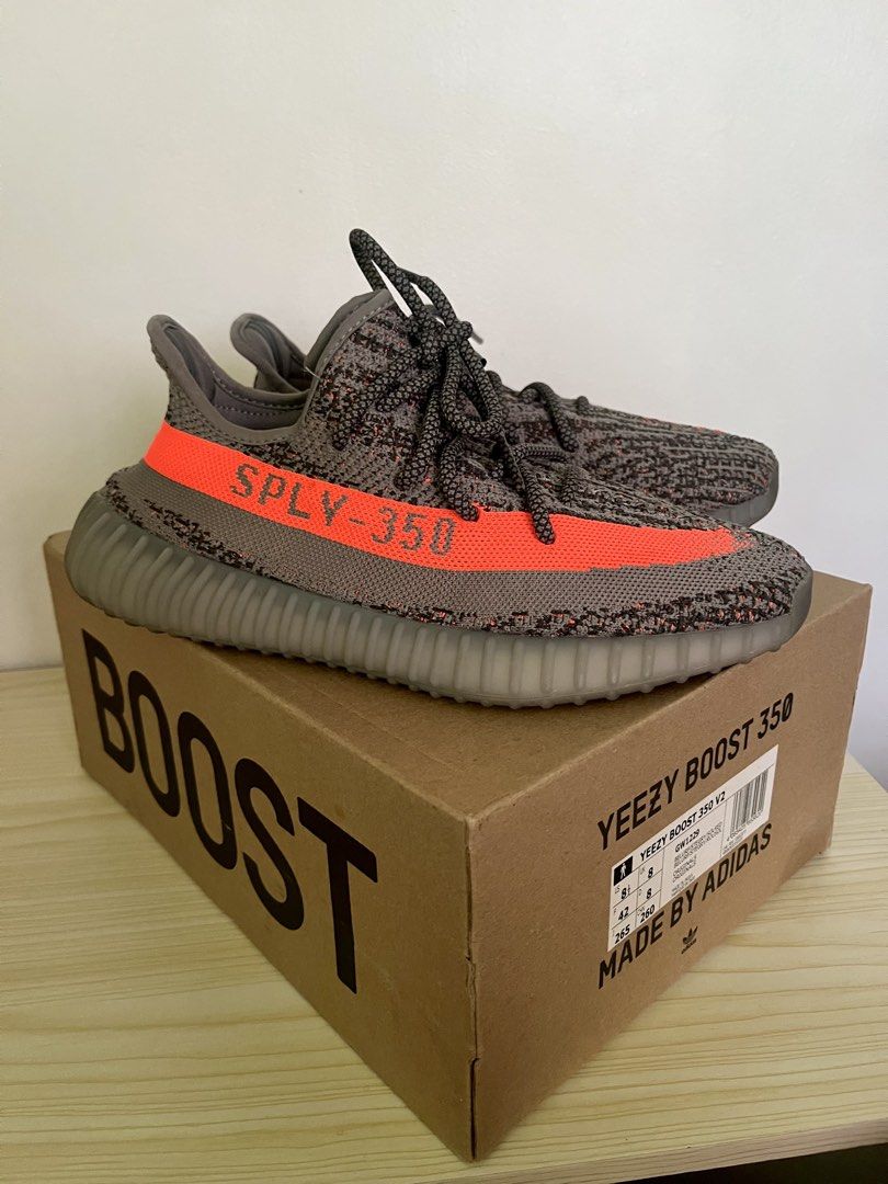 Adidas Yeezy Boost 350 V2 "Beluga Reflective" (Category: Sneakers) located in Rizal. Submitted by bautistakianne (Listing ID 1440167773, Image 1). Description: The adidas Yeezy Boost 350 V2 “Beluga Reflective” (model GW1229) is a 2021 update to the original 2016 “Beluga” colorway, featuring a grey Primeknit upper with an orange “SPLY-350” side stripe and reflective threads woven throughout for enhanced visibility. It sits on a full-length Boost m