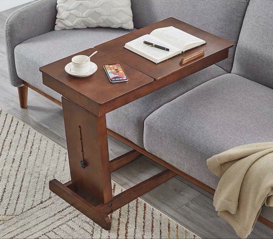 Adjustable Solid Wood Bedside Table (Category: Tables & Sets) located in Singapore. Submitted by alickingdom (Listing ID 1439996769, Image 1). Description: - Versatile bedside table for use over bed or sofa - Adjustable height for your comfort - Spacious surface ideal for laptops, books, or snacks - Sleek wooden design to match any decor - 80cm x 40cm x adjustable.