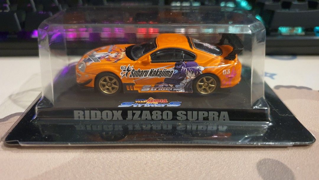 Aoshima 1/64 Ridox JZA80 Toyota Supra 'Strikers Subaru Nakajima' (Orange) *sporty *racing *JDM *anime not hotwheels (Category: Toys & Games) located in Bangi. Submitted by zeuszonic_resources (Listing ID 1440152737, Image 1). Description: Brand : Aoshima. Scale : 1/64. Very detailed. What you see is what you get. No box. Box/card/car is not perfect due to old stock & vintage item but overall is good. Tq 😉🙏🏽👍. #kyosho #minigt #aoshima #inno #t