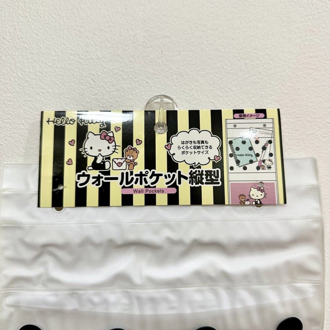 [Authentic] Hello Kitty Wall Pocket Organizer Hanging Storage (Category: Storage Boxes & Baskets) located in Quezon City. Submitted by brandedusagoodies (Listing ID 1440156715, Image 2). Description: Authentic Sanrio Hello Kitty wall pocket organizer featuring a classic black-and-white polka dot design with pink accents and Hello Kitty artwork. A cute and functional storage piece for organizing photos, stationery, accessories, and small items whi