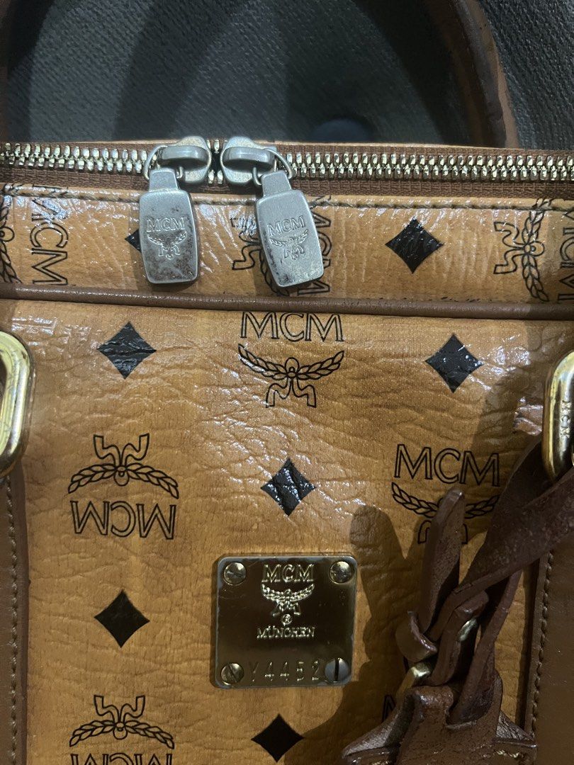 Authentic MCM Cognac Laptop/Document Bag (Category: Luxury Bags & Wallets) located in Manila. Submitted by sanyatagle08878 (Listing ID 1440089684, Image 3). Description: - Authentic MCM Cognac Laptop/Document Bag - Can fit 13-inch laptop - Turnable screws - Gold MCM logo plate on front Issues: Please check the photos posted. Some issues are labas piping, bag handle scratches and in some part of the bags. Location: La Loma, QC RFS: decluttering so