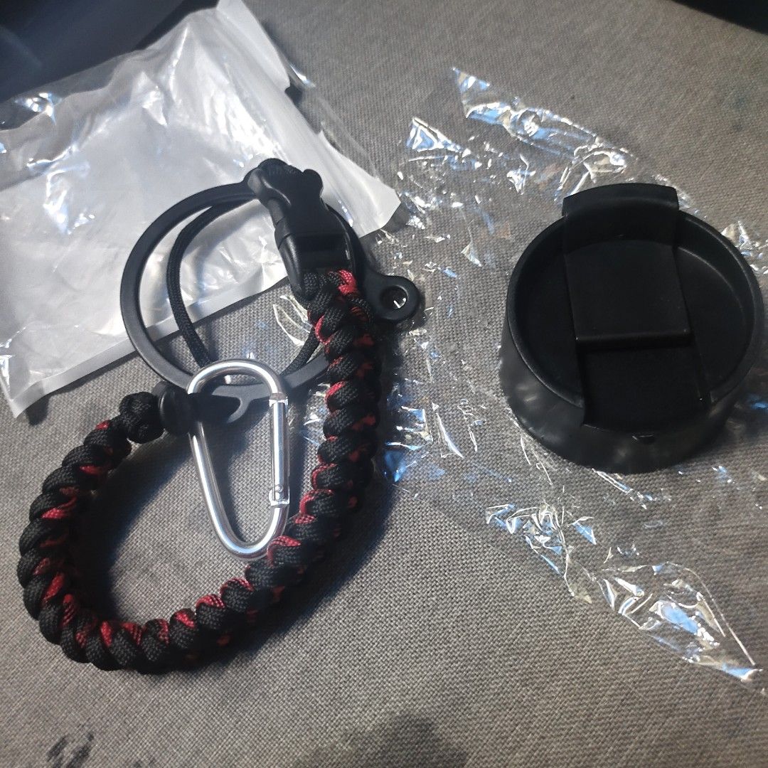 Black Tumbler Lid with Paracord Strap and Carabiner (Category: Water Bottles & Tumblers) located in Quezon City. Submitted by dncpreloved (Listing ID 1440060066, Image 1). Description: - Black tumbler lid with secure flip-top closure - Durable black and red paracord strap - Features quick-release buckle and metal carabiner - size 5.7cm Mouth Diameter RFS: doesn't fit my tumbler .