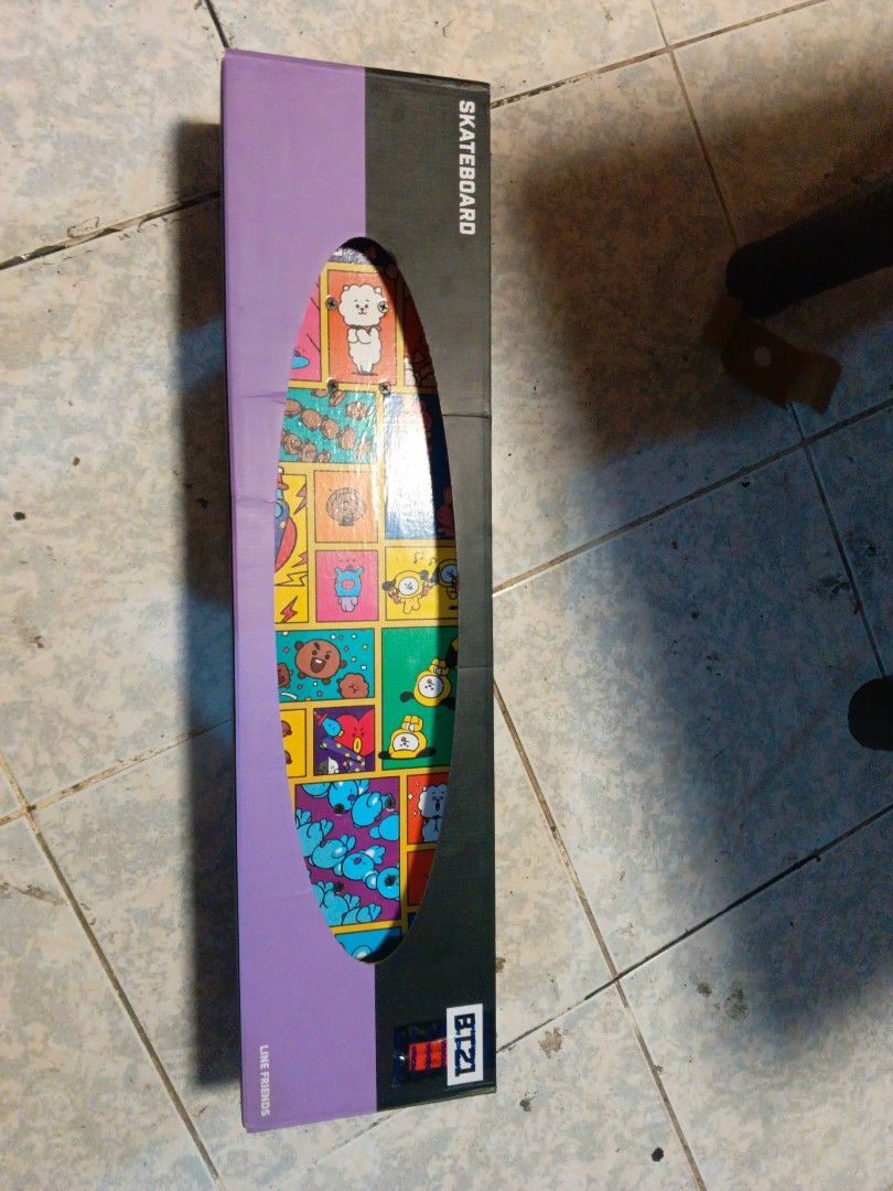 BT21 Skateboard with Cartoon Design (Category: Skates, Rollerblades & Scooters) located in Manila. Submitted by boldeagle.e6da01 (Listing ID 1440179384, Image 1). Description: - Official BT21 Skateboard - Vibrant and playful cartoon character design - Features a grid pattern of various BT21 characters on the deck - Comes in branded BT21 packaging - Ideal for BT21 fans and skateboarding enthusiasts.