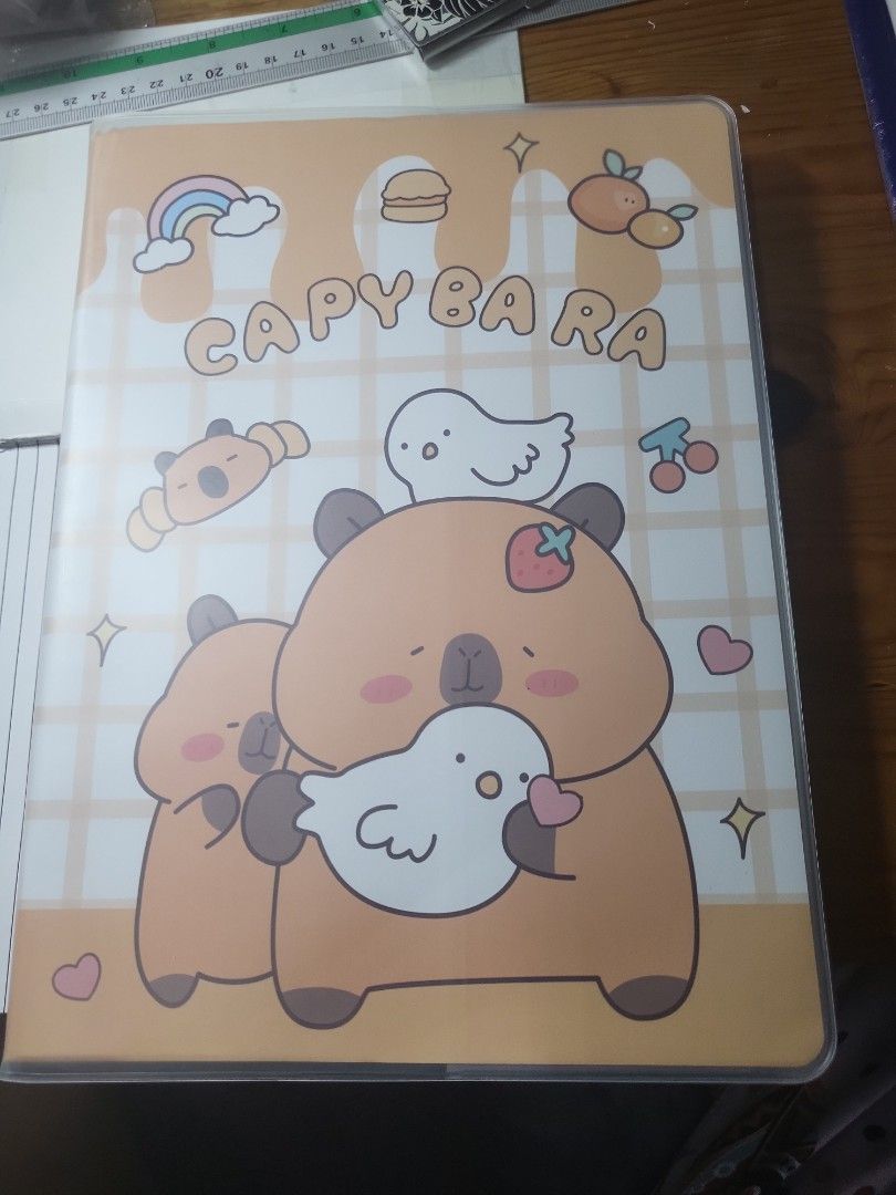 Capybara Design Notebook with Lined Pages (Category: Stationery & School Supplies) located in Caloocan City. Submitted by lynette1977 (Listing ID 1440025285, Image 1). Description: - Perfect for journaling, note-taking, or sketching - Lined pages for neat writing - Durable cover for protection - Ideal for students, artists, and stationery lovers.