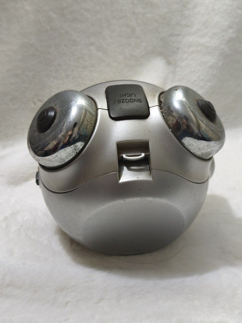 Casio Sleep Buster Analog Alarm Clock (Category: Clocks) located in Manila. Submitted by ed16montes96618 (Listing ID 1440011073, Image 3). Description: Vintage Casio Sleep Buster analog alarm clock. Features a classic twin-bell design with a silver-tone metallic finish. The clock has a clear analog display with Arabic numerals and a quartz movement. Includes a snooze and light function. Perfect for bedside tables or collectors..