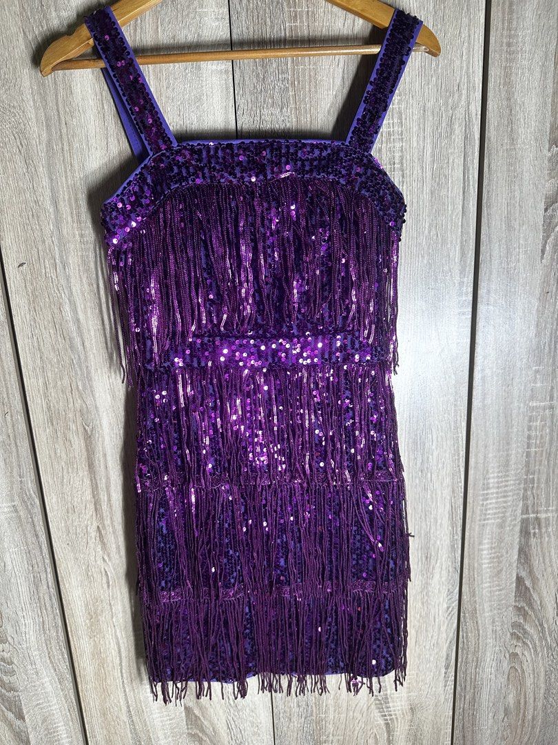 CHOSMO Purple Sequin Fringe Flapper Dress (Category: Dresses) located in Baguio. Submitted by ramosroch78721 (Listing ID 1440021508, Image 2). Description: - Dazzling purple flapper dress by CHOSMO - Features a sequin base - Shimmering fringe layers - Beaded straps for extra sparkle - Ideal for parties, Halloween, or any festive occasion - Vibrant and eye-catching design.