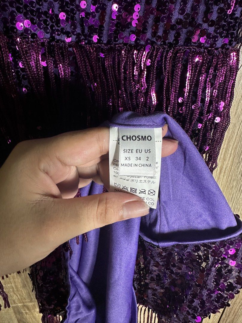 CHOSMO Purple Sequin Fringe Flapper Dress (Category: Dresses) located in Baguio. Submitted by ramosroch78721 (Listing ID 1440021508, Image 3). Description: - Dazzling purple flapper dress by CHOSMO - Features a sequin base - Shimmering fringe layers - Beaded straps for extra sparkle - Ideal for parties, Halloween, or any festive occasion - Vibrant and eye-catching design.