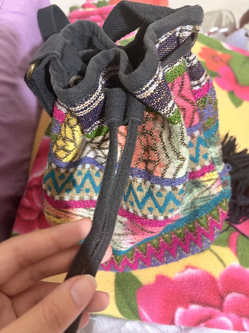 CLAIRE’S Boho Woven Drawstring Bag with Tassels (Category: Beach Bags) located in Quezon City. Submitted by martinatrajano (Listing ID 1440016064, Image 2). Description: - Vibrant woven drawstring bag - Colorful geometric designs - Secure drawstring closure - Playful black tassels at the bottom - Adjustable strap for crossbody or shoulder wear - Perfect for a bohemian style.