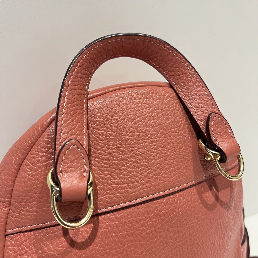 Coach Andi Mini pink Backpack (Category: Luxury Bags & Wallets) located in Paranaque City. Submitted by missb1001 (Listing ID 1440145676, Image 3). Description: Authentic 💯 Overall condition: 9.5/10 Salmon pink leather body Gold hardwares Issue: small chip on bag’s creed Dimensions: 7.5in L x 9.5in H .