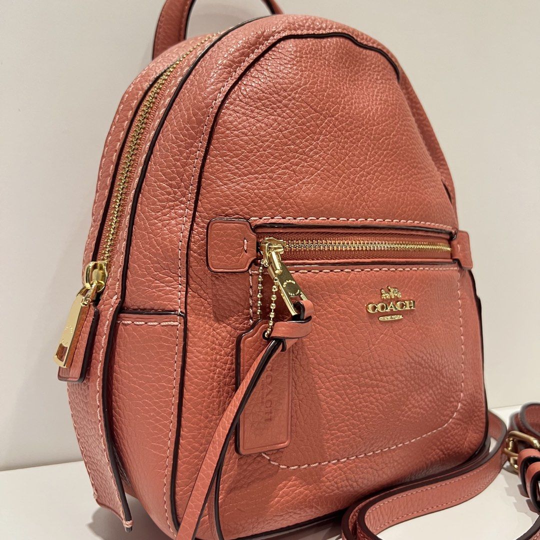 Coach Andi Mini pink Backpack (Category: Luxury Bags & Wallets) located in Paranaque City. Submitted by missb1001 (Listing ID 1440145676, Image 2). Description: Authentic 💯 Overall condition: 9.5/10 Salmon pink leather body Gold hardwares Issue: small chip on bag’s creed Dimensions: 7.5in L x 9.5in H .