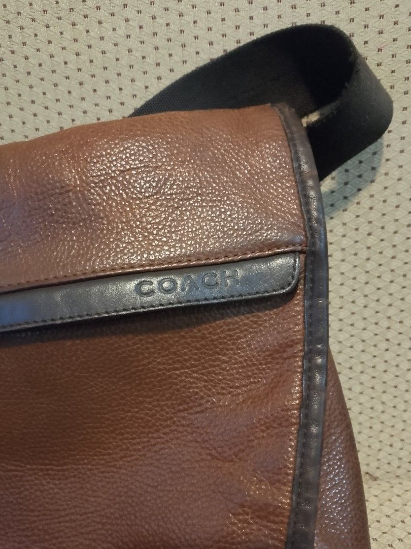 Coach Brown Leather Messenger Bag (Category: Luxury Bags & Wallets) located in Quezon City. Submitted by tracermarky (Listing ID 1440188845, Image 2). Description: - Authentic Coach messenger bag - Rich brown pebbled leather - Black trim and adjustable black strap - Interior with multiple compartments for organization - Stylish and practical for everyday use.