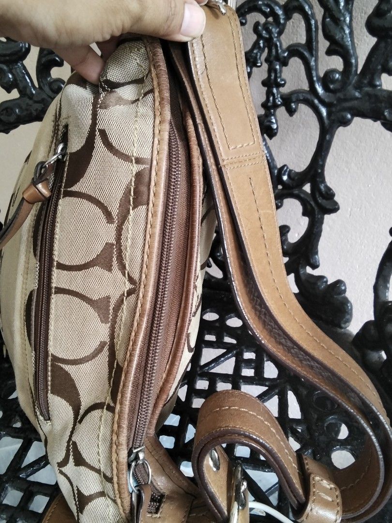 Coach Monogram Canvas Leather Hobo Shoulder Bag (Category: Luxury Bags & Wallets) located in Bugasong. Submitted by sofiewaffle (Listing ID 1440086420, Image 3). Description: - Authentic Coach hobo bag - Signature monogram canvas with genuine leather trim - Zippered main compartment - Exterior zippered pocket for easy access - Adjustable leather strap for comfortable wear - Stylish and practical for everyday use -well used but good used p po.