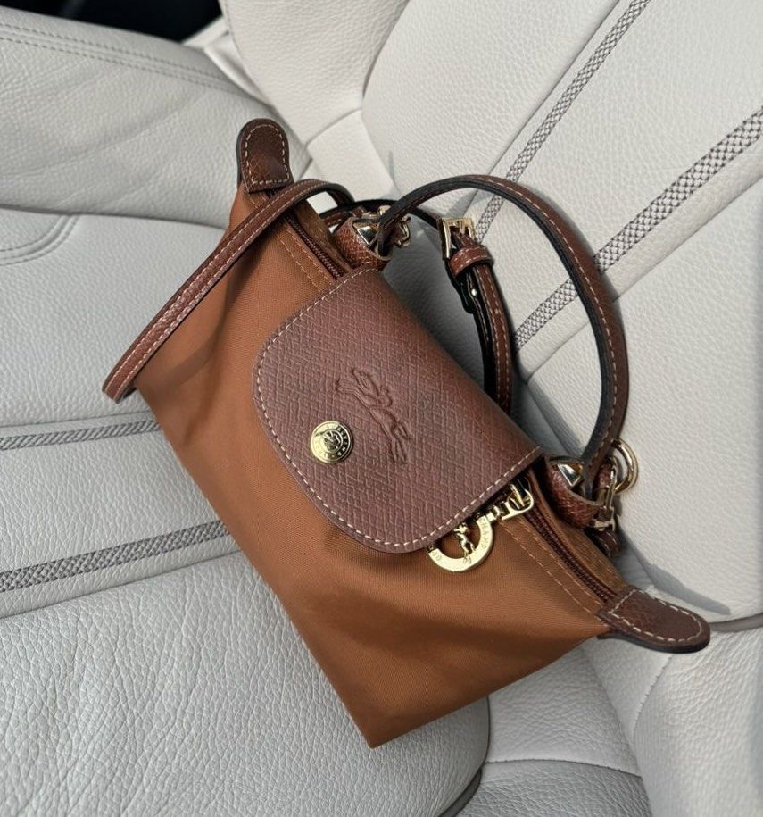 Cognac Longchamp Mini Xs Top Handle Bag with straps (Category: Luxury Bags & Wallets) located in Manila. Submitted by _girlfinds (Listing ID 1440154544, Image 1). Description: 👜 LONGCHAMP LE PLIAGE – JAPAN SOURCED, YES TO RUSH SHIPPING! Elevate your daily style with this classic and functional Longchamp tote. 📍 Sourced directly from Japan – self authentication with the provided photos, premium quality. ➕ Want a comfier grip? 💼 Add ₱300 for thi
