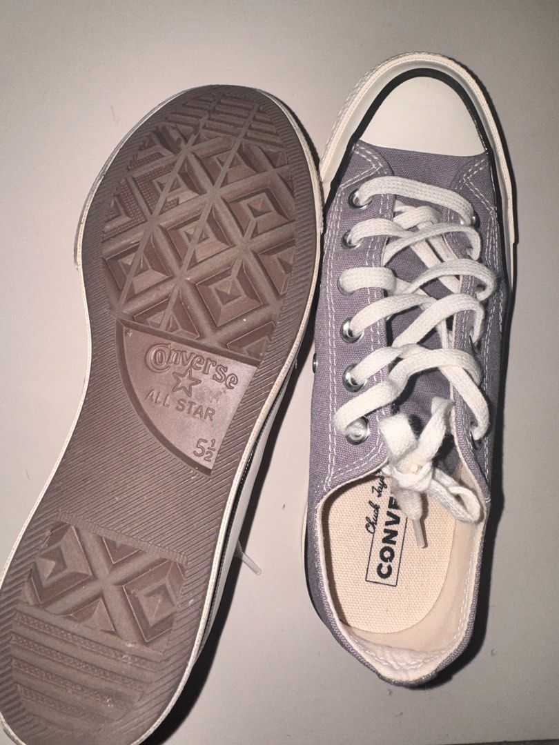 Converse Chuck Taylor All Star Low Top Sneakers (Category: Sneakers) located in Manila. Submitted by declutters137 (Listing ID 1440080883, Image 2). Description: - Classic Converse Chuck Taylor All Star low top sneakers - Cool purple grey color - Iconic Chuck Taylor branding on insole - Converse All Star logo on durable rubber outsole - Perfect for everyday wear - Adds a touch of retro style to any outfit Used only twice. Fit is too tight on me A