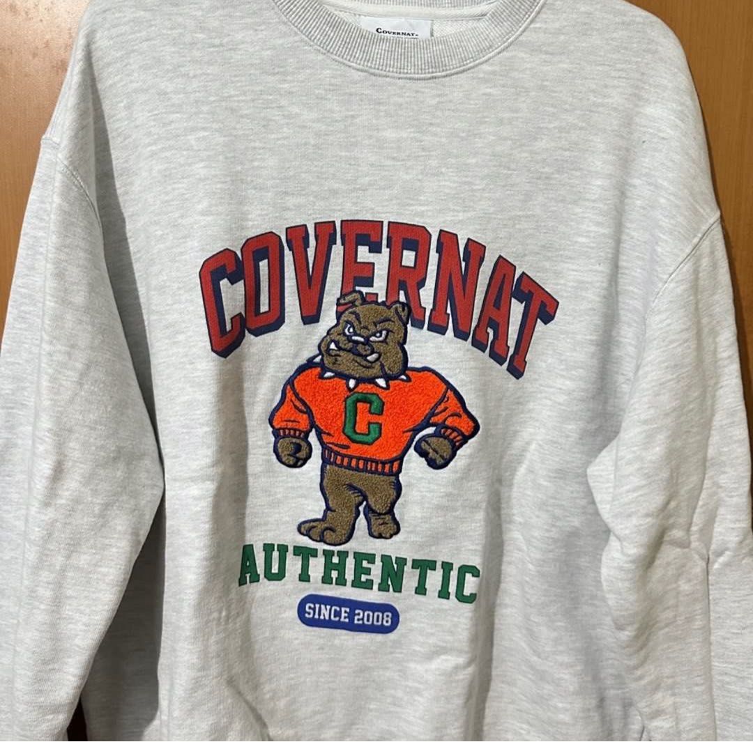 Covernat Sweatshirt (Category: Coats, Jackets and Outerwear) located in Mandaluyong City. Submitted by vwonu (Listing ID 1440119978, Image 2). Description: - Width 22.5 - Length 27 - Grey COVERTNAT sweatshirt - Features a bold bulldog graphic print wearing a varsity jacket - Text 'COVERTNAT AUTHENTIC SINCE 2008' on print - Classic fit crewneck - Made from comfortable, mid-weight fabric - Ideal for casual wear.