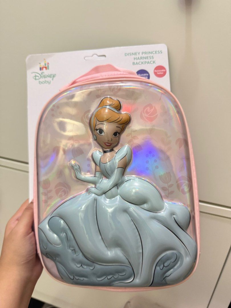 Disney Baby Princess Cinderella Harness Backpack (Category: Babies & Kids Fashion) located in Mandaluyong City. Submitted by projectsaleph (Listing ID 1440123974, Image 1). Description: - Adorable Disney Baby Cinderella harness backpack - Features a clear iridescent front with a 3D Cinderella design - Ideal for toddlers and young children - Allows kids to carry their own essentials - Keeps children close and secure - Charming pink trim and handle