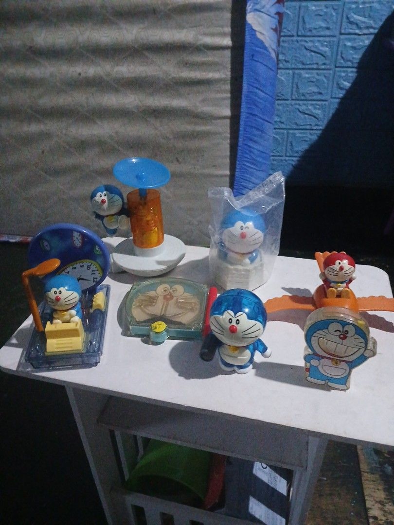 Doraemon mcdonalds Toys Collections (Category: Character Goods) located in Manila. Submitted by diczenestr94951 (Listing ID 1440098323, Image 2). Description: - Collection of Doraemon toys in various poses and with accessories. - Includes: Doraemon with wings, Doraemon in a clear case, Doraemon with a suction cup, and Doraemon with a clock. - Some items are still in their original packaging. - Perfect for Doraemon enthusiasts and collectors..